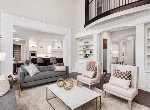 Bright, refined living room with an open kitchen beyond